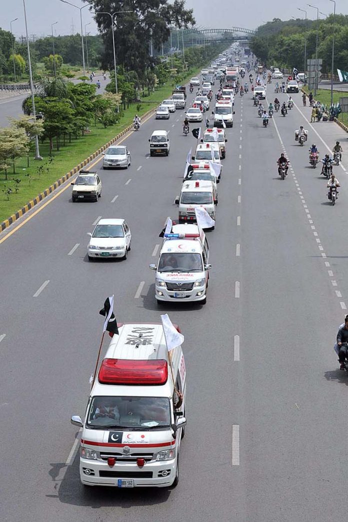 PRCS ambulances are participating in a flag march on the occasion of 77th Independence Day celebration