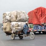 An overloaded tricycle holder coming wrong side of the busy bypass road may cause a mishap