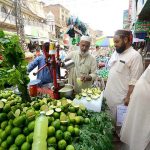 A vendor selling lemonade at Qissa Khawani Bazaar during hot weather in the city