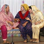 Artists performing on stage during a family drama "Watan Ki Mitti Gawah Rehna" in connection with Independence Day at Arts Council