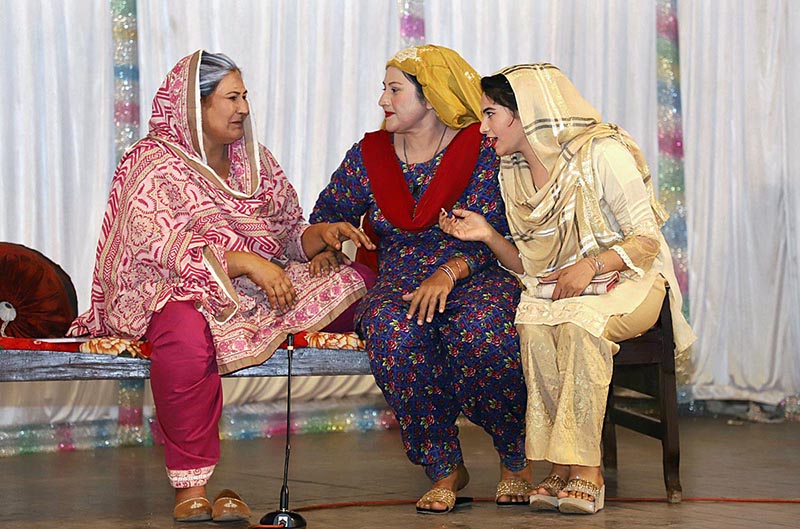 Artists performing on stage during a family drama "Watan Ki Mitti Gawah Rehna" in connection with Independence Day at Arts Council