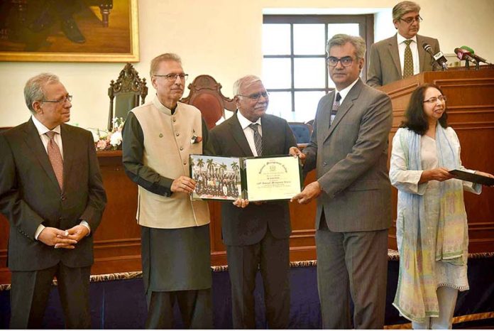 President Dr. Arif Alvi distributes certificates among the participants of Graduation Ceremony of NMC at National School of Public Policy