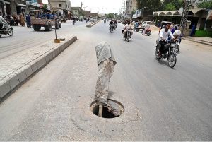 A view of open main hole at Hala Naka Road may cause any mishap and needs the attention of concerned authorities