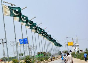 A beautiful view of national flags waving on the electric poles at Qasimabad
