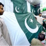 Vendor displaying national flag and other stuff to attract the customers in connection with upcoming Independence Day celebrations