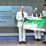 Prime Minister Muhammad Shehbaz Sharif distributing health insurance cards among the working journalists, media workers, artists and technical resource workers