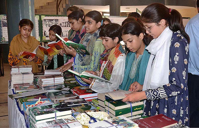 Visitor women watching the Photographic Exhibition of Quaid e Azam in connection to the upcoming independence day at the Arts Council
