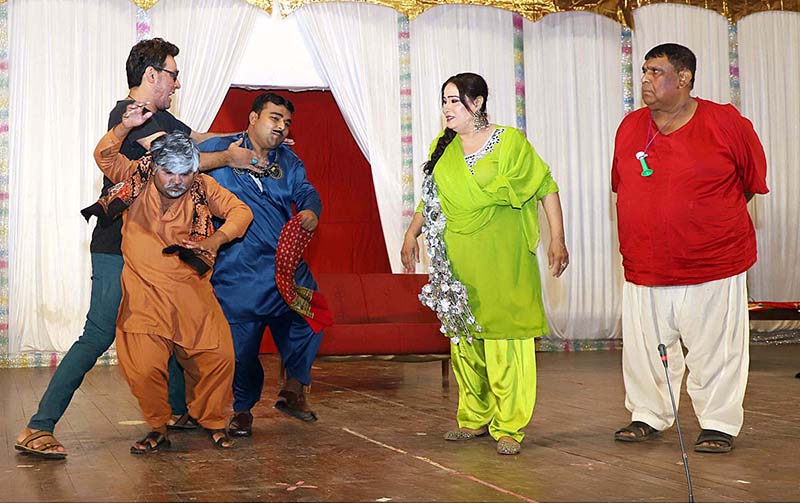 Artists performing on stage during a family drama "Watan Ki Mitti Gawah Rehna" in connection with Independence Day at Arts Council