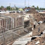 Labourers busy in construction work of IJP Road during development work in the city