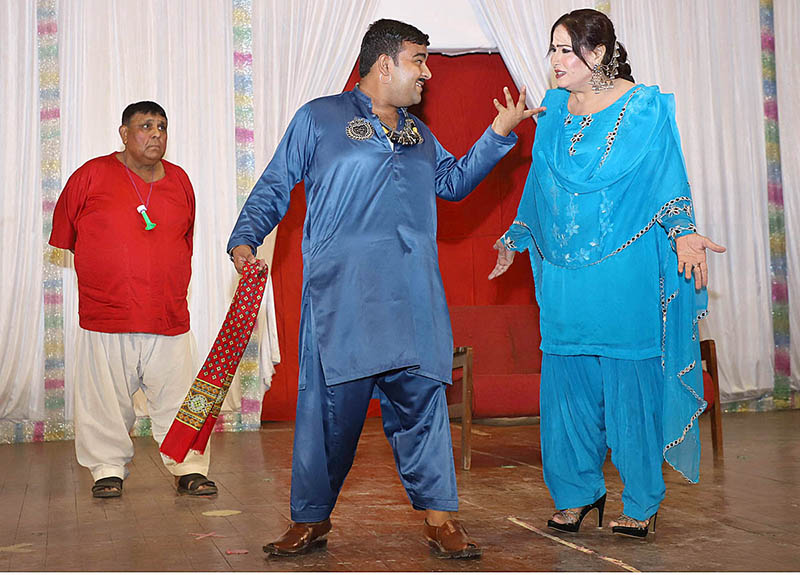 Artists performing on stage during a family drama "Watan Ki Mitti Gawah Rehna" in connection with Independence Day at Arts Council