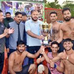 ADC Finance Waqar Akbar Cheema giving the trophy to the team of Hazro who secured the 1st position in the Kabaddi Match held on the occasion of 77th Independence Day celebration