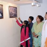 Visitor keenly viewing pictures exhibition after inaugurate in connection with Kashmir Black Day (Yaum Istehsal Kashmir) at Arts Council