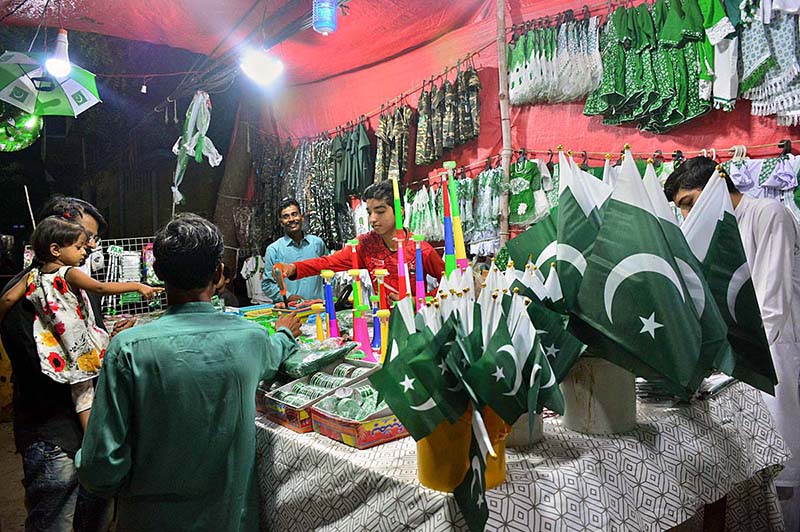 A vendor displaying national flag and other stuff to attract the customers in connection with upcoming Independence Day celebrations