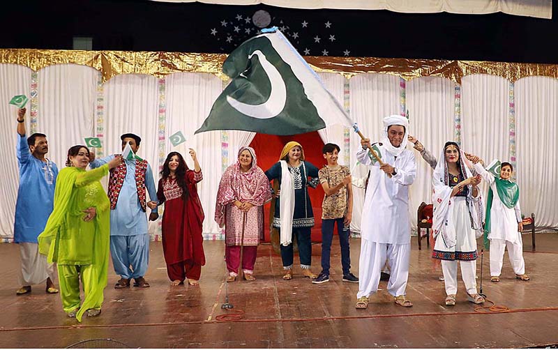 Artists performing on stage during a family drama "Watan Ki Mitti Gawah Rehna" in connection with Independence Day at Arts Council