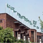 A view of National Flags waving on the top of Hilal-e-Ahmer Hospital building in connection with Independence Day celebrations in the city