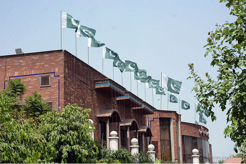 A view of National Flags waving on the top of Hilal-e-Ahmer Hospital building in connection with Independence Day celebrations in the city