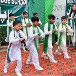 Students are performing tableau in connection with Pakistan Independence Day celebrations at RC School