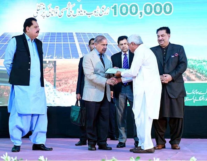 Prime Minister Muhammad Shehbaz Sharif giving certificates to farmers during the launching ceremony of National Program for the Solarization of Agricultural Tubewells Prime Minister Muhammad Shehbaz Sharif giving certificates to farmers during the launching ceremony of National Program for the Solarization of Agricultural Tubewells