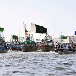 Local fishermen participate in Independence Day Boat Rally arranged by Pakistan Navy at Karachi Harbour