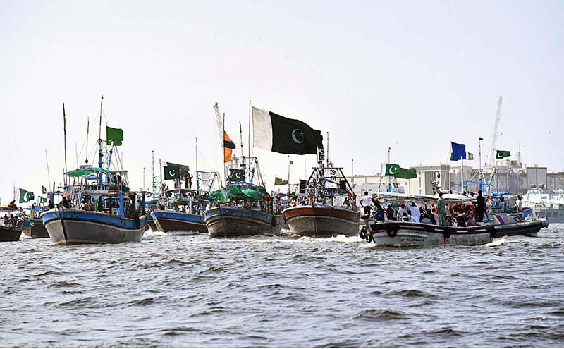 Local fishermen participate in Independence Day Boat Rally arranged by Pakistan Navy at Karachi Harbour