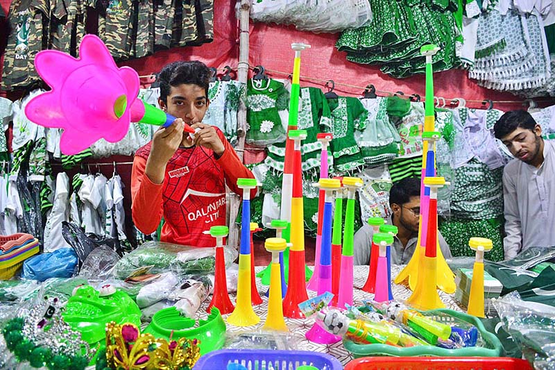 A vendor displaying national flag and other stuff to attract the customers in connection with upcoming Independence Day celebrations