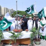 ISRA University officials hoist the national flag to celebrate Independence Day celebration