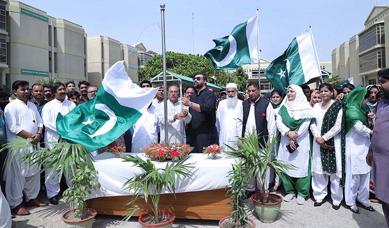 ISRA University officials hoist the national flag to celebrate Independence Day celebration