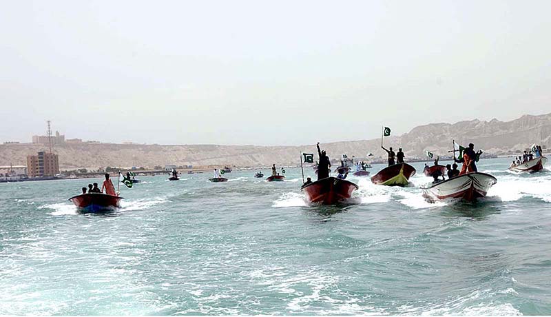 Local fishermen participate in Independence Day Boat Rally arranged by Pakistan Navy at Karachi Harbour