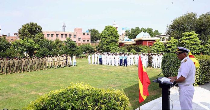 Deputy Commandant Pakistan Navy War College addressing the Officers and Sailors during flag hoisting ceremony held in connection with Independence Day celebrations