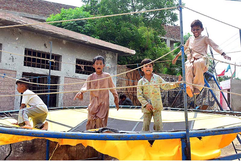 Children enjoy jumping on the trampoline at Latifabad