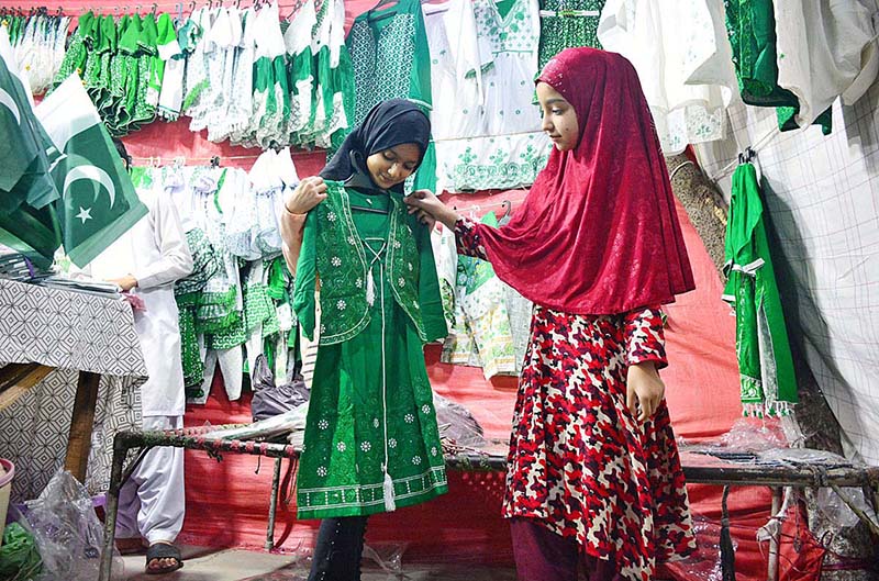A vendor displaying national flag and other stuff to attract the customers in connection with upcoming Independence Day celebrations