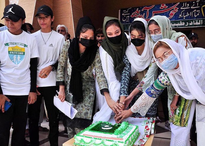 Students are cutting Independence Day Cake in a ceremony of international Youth Day organized by Sports Department and Peoples social welfare