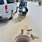 A view of open sewerage manhole on the road at Bhitai Hospital Road may cause any mishap and needs the attention of concerned authorities