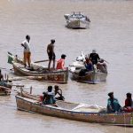Fisherman busy in fishing at Indus River