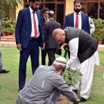 President Dr Arif Alvi planting a mango sapling at Governor House