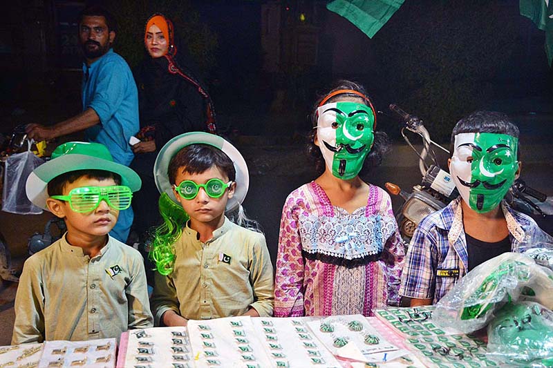 A vendor displaying national flag and other stuff to attract the customers in connection with upcoming Independence Day celebrations