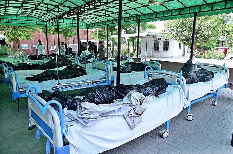 RESCUE 1122 officials extinguishing fire on bus after incidence while eighteen people were killed and fifteen others injured when a passenger bus caught fire after being smashed into a pick-up carrying diesel drums at Motorway near Pindi Bhattian