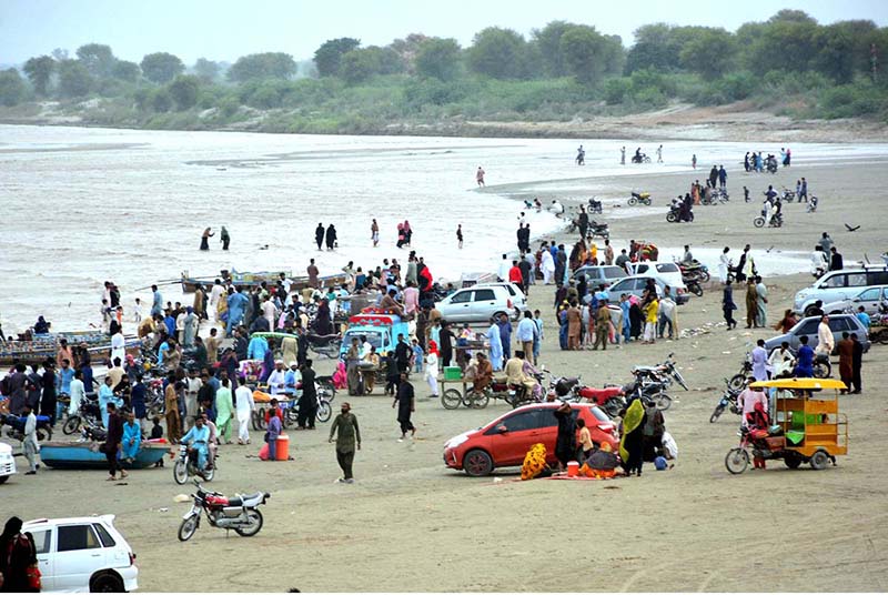 Numerous families are relishing a picnic by the Indus River during overcast weather, following the rise in water level in the river