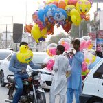 A man arranging animal fodder to deliver other cities