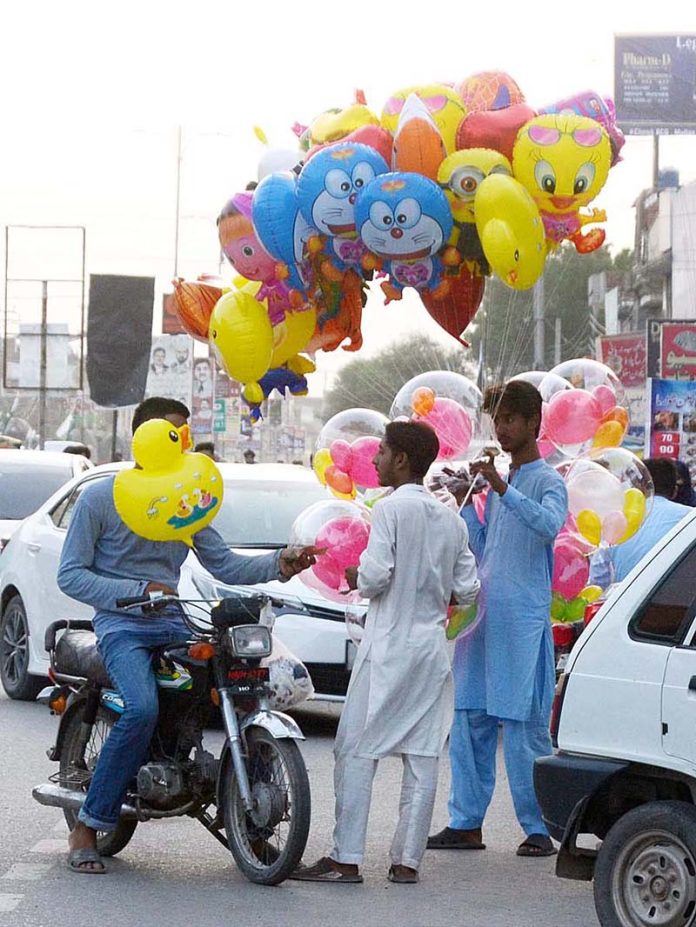 A man arranging animal fodder to deliver other cities A man arranging animal fodder to deliver other cities