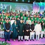 President Dr. Arif Alvi in a group photo with children who performed medleys at the official flag hoisting ceremony on the 77th Independence Day of Pakistan