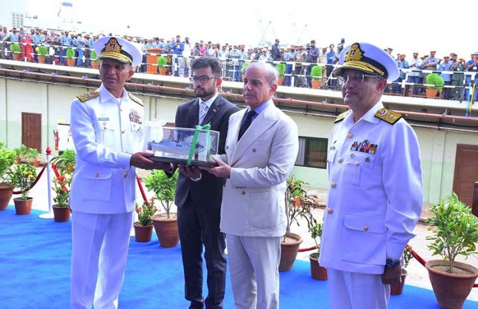 August 02 - Chief of Naval Staff Admiral Muhammad Amjad Khan Niazi presenting a model of a ship to Prime Minister Muhammad Shehbaz Sharif during the launching ceremony of PNS Tariq