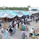 People purchasing different domestic use items in the Sunday Bazar