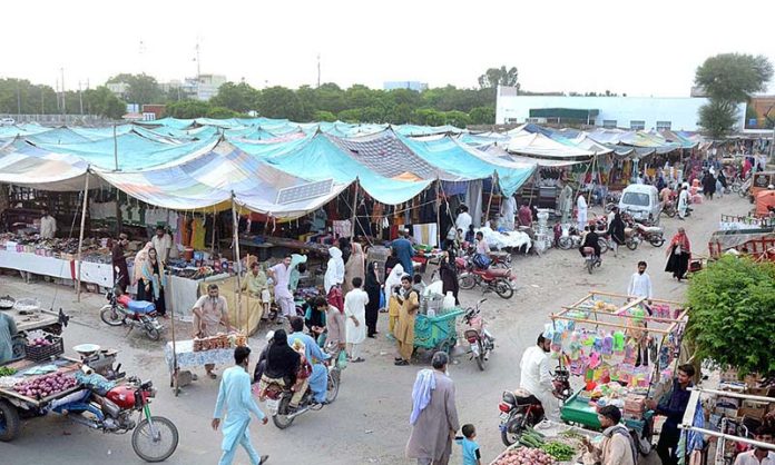 People purchasing different domestic use items in the Sunday Bazar