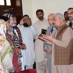 Federal Ombudsman Ejaz Ahmad Qureshi talking with the transgender community at Circuit House