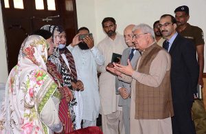 Federal Ombudsman Ejaz Ahmad Qureshi talking with the transgender community at Circuit House