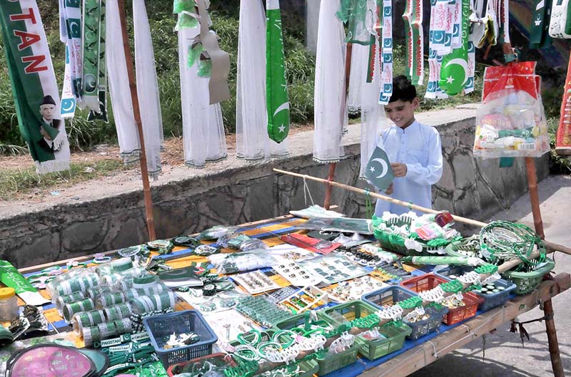 Commuters take break to purchase national flag as the nation celebrates the Independence Day with evangelism across the country