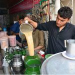 Vendor is preparing tea for his customers at his workplace