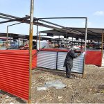 Workers busy in preparing new stalls at Fruit and Vegetable Market