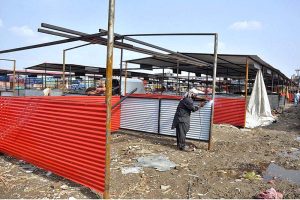 Workers busy in preparing new stalls at Fruit and Vegetable Market